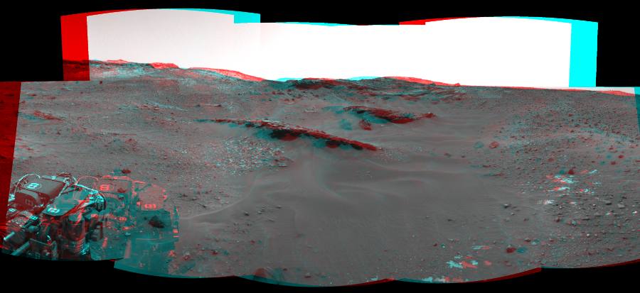 NASA's Mars rover Curiosity took 9 image pairs in Gale Crater using its mast-mounted Navigation Camera (Navcam) to create this mosaic. The seam-corrected mosaic provides a 164-degree cylindrical perspective projection panorama of the Martian surface suitable for stereo viewing, centered at 349 degrees azimuth (measured clockwise from north). This anaglyph must be viewed with red/blue glasses (red over left eye).  Curiosity took the images on April 27, 2015, Sol 967 of the Mars Science Laboratory mission at drive 522, site number 47. The local mean solar time for the image exposures was from 1 PM to 3 PM. Each Navcam image has a 45-degree field of view. CREDIT: NASA/JPL-Caltech