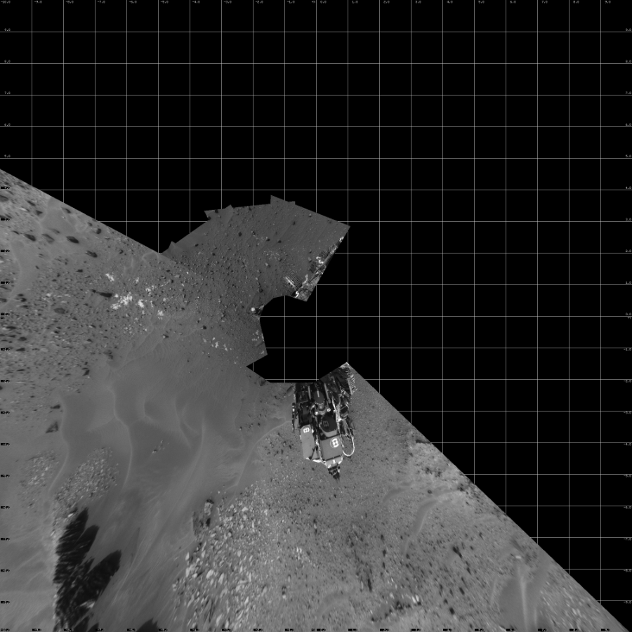 NASA's Mars rover Curiosity took 14 images in Gale Crater using its mast-mounted Left Navigation Camera (Navcam) to create this mosaic. The seam-corrected mosaic provides a vertical projection of the Martian surface near the rover, covering an area of 20 meters (north/south) by 20 meters (east/west). North is up in the image. This projection provides an overhead view, but introduces distortion for items not on the surface, such as large rocks and the rover itself.  Curiosity took the images on April 27, 2015, Sol 967 of the Mars Science Laboratory mission at drive 522, site number 47. The local mean solar time for the image exposures was from 1 PM to 3 PM. Each Navcam image has a 45-degree field of view. CREDIT: NASA/JPL-Caltech