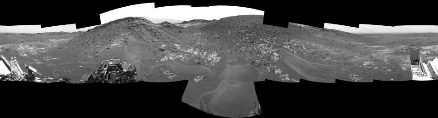 NASA's Mars rover Curiosity took 17 images in Gale Crater using its mast-mounted Left Navigation Camera (Navcam) to create this mosaic. The seam-corrected mosaic provides a 360-degree cylindrical-perspective projection panorama of the Martian surface suitable for stereo viewing, centered at 27 degrees azimuth (measured clockwise from north). This single-eye view must be combined with the partner right image to be viewed in stereo.  Curiosity took the images on May 08, 2015, Sol 978 of the Mars Science Laboratory mission at drive 1202, site number 47. The local mean solar time for the image exposures was 1 PM. Each Navcam image has a 45-degree field of view. CREDIT: NASA/JPL-Caltech