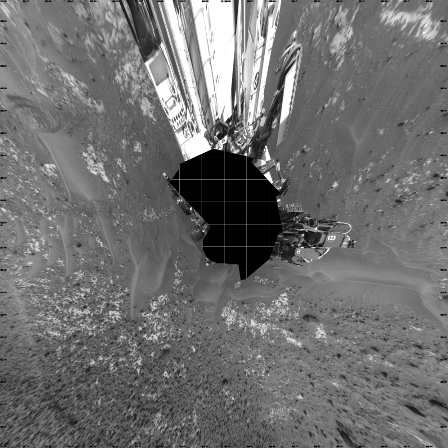 NASA's Mars rover Curiosity took 21 images in Gale Crater using its mast-mounted Left Navigation Camera (Navcam) to create this mosaic. The seam-corrected mosaic provides a vertical projection of the Martian surface near the rover, covering an area of 20 meters (north/south) by 20 meters (east/west). North is up in the image. This projection provides an overhead view, but introduces distortion for items not on the surface, such as large rocks and the rover itself.  Curiosity took the images on May 08, 2015, Sol 978 of the Mars Science Laboratory mission at drive 1202, site number 47. The local mean solar time for the image exposures was 1 PM. Each Navcam image has a 45-degree field of view. CREDIT: NASA/JPL-Caltech