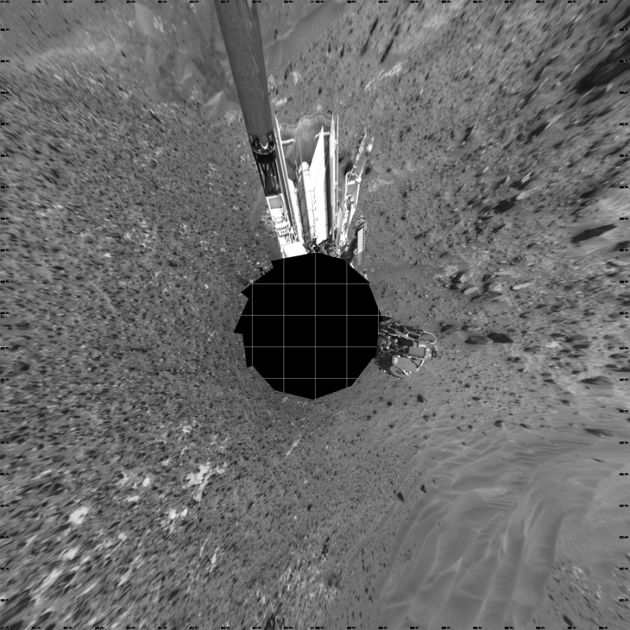 NASA's Mars rover Curiosity took 17 images in Gale Crater using its mast-mounted Left Navigation Camera (Navcam) to create this mosaic. The seam-corrected mosaic provides a vertical projection of the Martian surface near the rover, covering an area of 20 meters (north/south) by 20 meters (east/west). North is up in the image. This projection provides an overhead view, but introduces distortion for items not on the surface, such as large rocks and the rover itself.  Curiosity took the images on May 11, 2015, Sol 981 of the Mars Science Laboratory mission at drive 1452, site number 47. The local mean solar time for the image exposures was 12 PM. Each Navcam image has a 45-degree field of view. CREDIT: NASA/JPL-Caltech