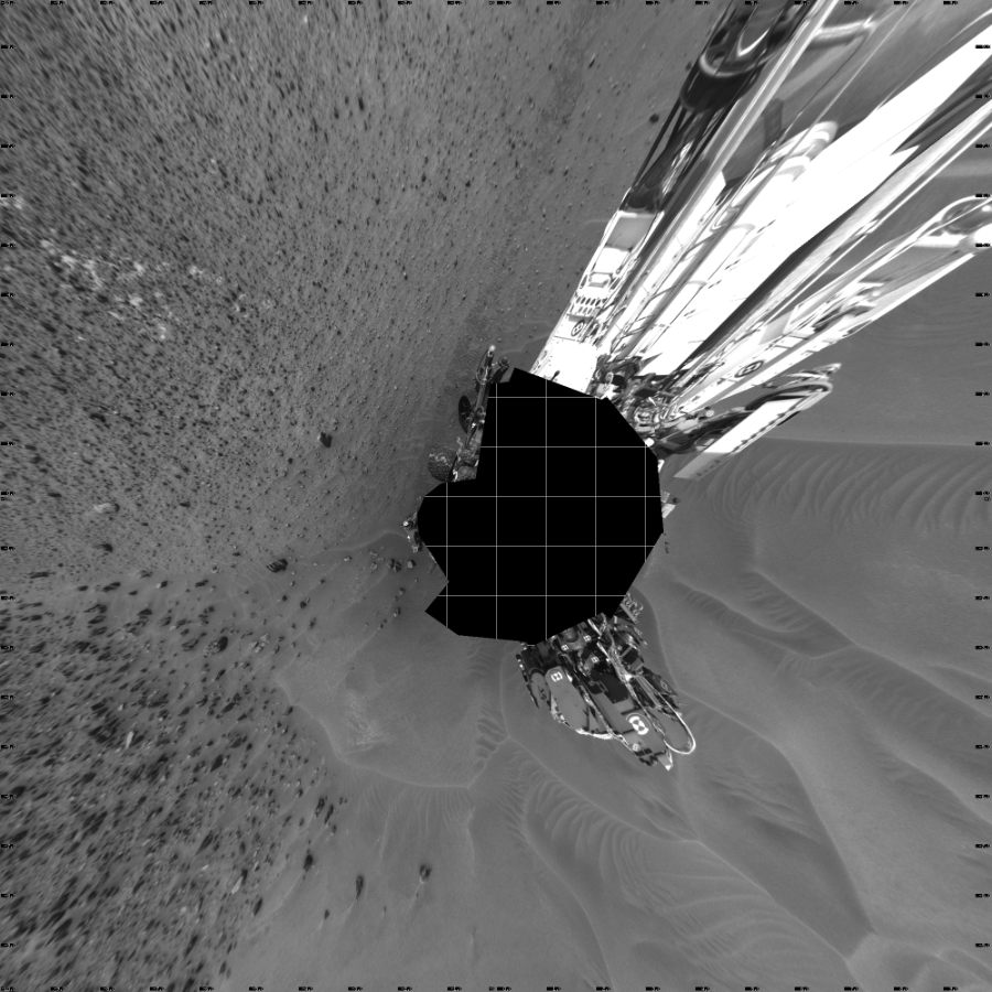 NASA's Mars rover Curiosity took 22 images in Gale Crater using its mast-mounted Left Navigation Camera (Navcam) to create this mosaic. The seam-corrected mosaic provides a vertical projection of the Martian surface near the rover, covering an area of 20 meters (north/south) by 20 meters (east/west). North is up in the image. This projection provides an overhead view, but introduces distortion for items not on the surface, such as large rocks and the rover itself. Curiosity took the images on May 13, 2015, Sol 983 of the Mars Science Laboratory mission at drive 1632, site number 47. The local mean solar time for the image exposures was 1 PM. Each Navcam image has a 45-degree field of view. CREDIT: NASA/JPL-Caltech