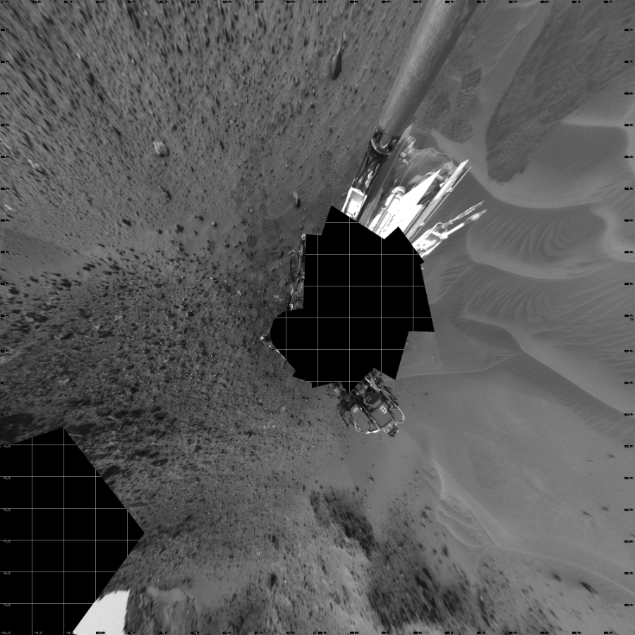 NASA's Mars rover Curiosity took 17 images in Gale Crater using its mast-mounted Left Navigation Camera (Navcam) to create this mosaic. The seam-corrected mosaic provides a vertical projection of the Martian surface near the rover, covering an area of 20 meters (north/south) by 20 meters (east/west). North is up in the image. This projection provides an overhead view, but introduces distortion for items not on the surface, such as large rocks and the rover itself.  Curiosity took the images on May 14, 2015, Sol 984 of the Mars Science Laboratory mission at drive 0, site number 48. The local mean solar time for the image exposures was 2 PM. Each Navcam image has a 45-degree field of view. CREDIT: NASA/JPL-Caltech