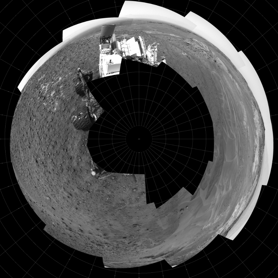 NASA's Mars rover Curiosity took 17 images in Gale Crater using its mast-mounted Left Navigation Camera (Navcam) to create this mosaic. The seam-corrected mosaic provides a polar stereographic projection panorama of the Martian surface with 0 degrees azimuth (measured clockwise from north) at the top of the image. Curiosity took the images on May 16, 2015, Sol 986 of the Mars Science Laboratory mission at drive 82, site number 48. The local mean solar time for the image exposures was 1 PM. Each Navcam image has a 45-degree field of view. CREDIT: NASA/JPL-Caltech