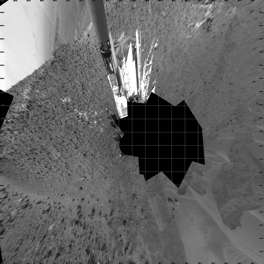 NASA's Mars rover Curiosity took 17 images in Gale Crater using its mast-mounted Left Navigation Camera (Navcam) to create this mosaic. The seam-corrected mosaic provides a vertical projection of the Martian surface near the rover, covering an area of 20 meters (north/south) by 20 meters (east/west). North is up in the image. This projection provides an overhead view, but introduces distortion for items not on the surface, such as large rocks and the rover itself.  Curiosity took the images on May 16, 2015, Sol 986 of the Mars Science Laboratory mission at drive 82, site number 48. The local mean solar time for the image exposures was 1 PM. Each Navcam image has a 45-degree field of view. CREDIT: NASA/JPL-Caltech