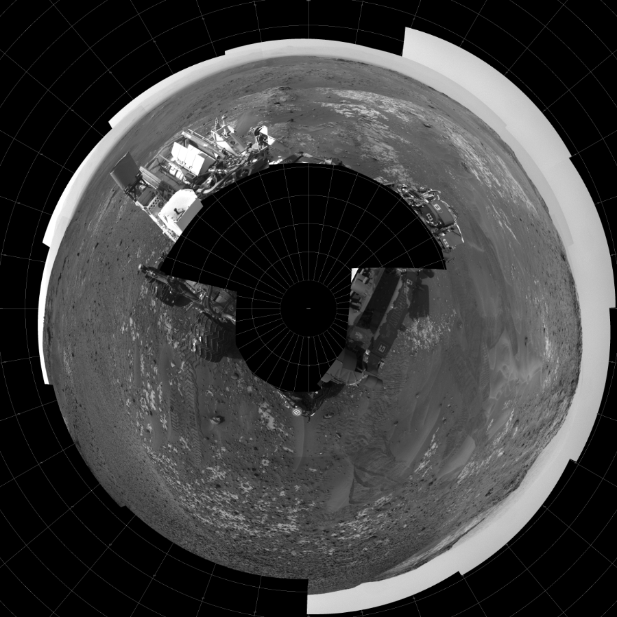 NASA's Mars rover Curiosity took 24 images in Gale Crater using its mast-mounted Left Navigation Camera (Navcam) to create this mosaic. The seam-corrected mosaic provides a polar stereographic projection panorama of the Martian surface with 0 degrees azimuth (measured clockwise from north) at the top of the image. Curiosity took the images on May 17, 2015, Sol 987 of the Mars Science Laboratory mission at drive 458, site number 48. The local mean solar time for the image exposures was 3 PM. Each Navcam image has a 45-degree field of view. CREDIT: NASA/JPL-Caltech
