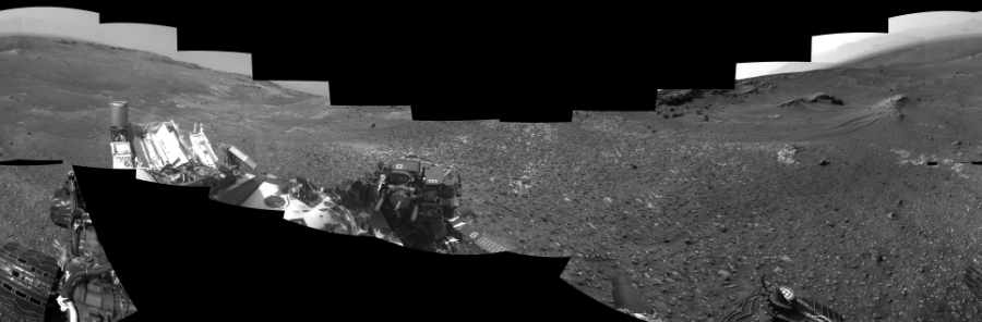 NASA's Mars rover Curiosity took 17 images in Gale Crater using its mast-mounted Left Navigation Camera (Navcam) to create this mosaic. The seam-corrected mosaic provides a 360-degree cylindrical-perspective projection panorama of the Martian surface suitable for stereo viewing, centered at 325 degrees azimuth (measured clockwise from north). This single-eye view must be combined with the partner right image to be viewed in stereo. Curiosity took the images on May 20, 2015, Sol 990 of the Mars Science Laboratory mission at drive 876, site number 48. The local mean solar time for the image exposures was from 2 PM to 3 PM. Each Navcam image has a 45-degree field of view. CREDIT: NASA/JPL-Caltech