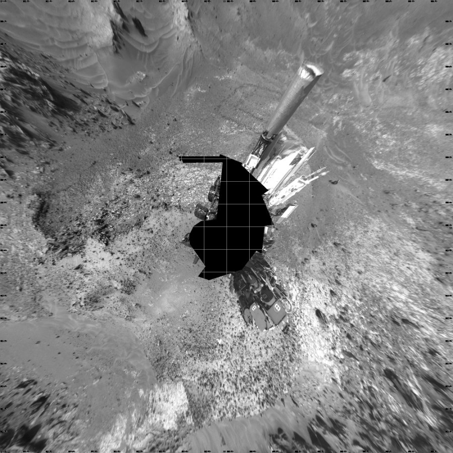 NASA's Mars rover Curiosity took 21 images in Gale Crater using its mast-mounted Left Navigation Camera (Navcam) to create this mosaic. The seam-corrected mosaic provides a vertical projection of the Martian surface near the rover, covering an area of 20 meters (north/south) by 20 meters (east/west). North is up in the image. This projection provides an overhead view, but introduces distortion for items not on the surface, such as large rocks and the rover itself.  Curiosity took the images on May 21, 2015, Sol 991 of the Mars Science Laboratory mission at drive 1146, site number 48. The local mean solar time for the image exposures was from 1 PM to 2 PM. Each Navcam image has a 45-degree field of view. CREDIT: NASA/JPL-Caltech
