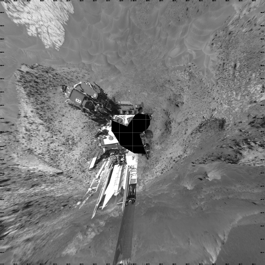 NASA's Mars rover Curiosity took 24 images in Gale Crater using its mast-mounted Left Navigation Camera (Navcam) to create this mosaic. The seam-corrected mosaic provides a vertical projection of the Martian surface near the rover, covering an area of 20 meters (north/south) by 20 meters (east/west). North is up in the image. This projection provides an overhead view, but introduces distortion for items not on the surface, such as large rocks and the rover itself.  Curiosity took the images on May 22, 2015, Sol 992 of the Mars Science Laboratory mission at drive 1194, site number 48. The local mean solar time for the image exposures was from 1 PM to 2 PM. Each Navcam image has a 45-degree field of view. CREDIT: NASA/JPL-Caltech