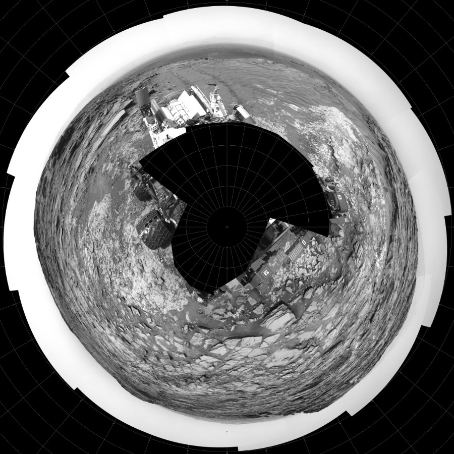 NASA's Mars rover Curiosity took 31 images in Gale Crater using its mast-mounted Left Navigation Camera (Navcam) to create this mosaic. The seam-corrected mosaic provides a polar stereographic projection panorama of the Martian surface with 0 degrees azimuth (measured clockwise from north) at the top of the image. Curiosity took the images on May 28, 2015, Sol 997 of the Mars Science Laboratory mission at drive 1570, site number 48. The local mean solar time for the image exposures was 2 PM. Each Navcam image has a 45-degree field of view. CREDIT: NASA/JPL-Caltech