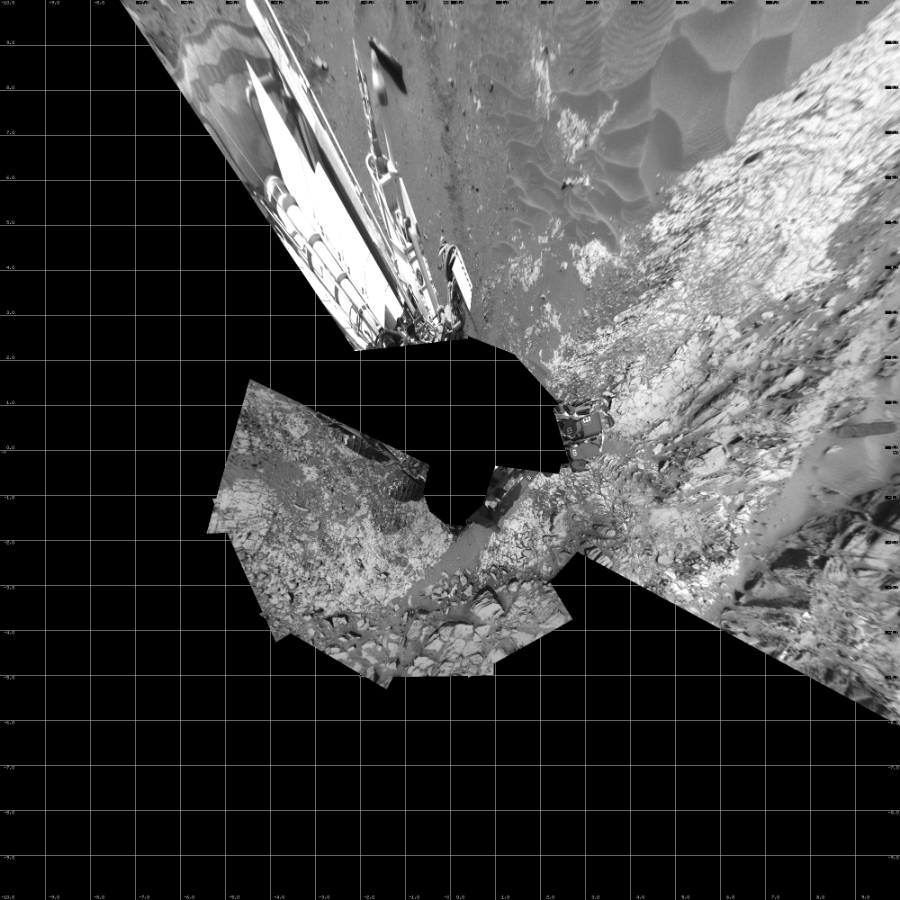 NASA's Mars rover Curiosity took 12 images in Gale Crater using its mast-mounted Left Navigation Camera (Navcam) to create this mosaic. The seam-corrected mosaic provides a vertical projection of the Martian surface near the rover, covering an area of 20 meters (north/south) by 20 meters (east/west). North is up in the image. This projection provides an overhead view, but introduces distortion for items not on the surface, such as large rocks and the rover itself. Curiosity took the images on June 30, 2015, Sol 1030 of the Mars Science Laboratory mission at drive 1600, site number 48. The local mean solar time for the image exposures was 2 PM. Each Navcam image has a 45-degree field of view. CREDIT: NASA/JPL-Caltech
