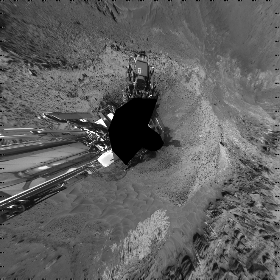 NASA's Mars rover Curiosity took 19 images in Gale Crater using its mast-mounted Left Navigation Camera (Navcam) to create this mosaic. The seam-corrected mosaic provides a vertical projection of the Martian surface near the rover, covering an area of 20 meters (north/south) by 20 meters (east/west). North is up in the image. This projection provides an overhead view, but introduces distortion for items not on the surface, such as large rocks and the rover itself.  Curiosity took the images on July 06, 2015, Sol 1035 of the Mars Science Laboratory mission at drive 1906, site number 48. The local mean solar time for the image exposures was from 3 PM to 4 PM. Each Navcam image has a 45-degree field of view. CREDIT: NASA/JPL-Caltech