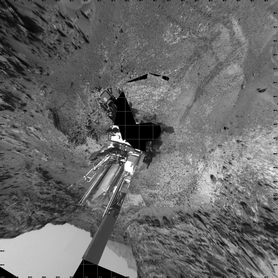 NASA's Mars rover Curiosity took 19 images in Gale Crater using its mast-mounted Left Navigation Camera (Navcam) to create this mosaic. The seam-corrected mosaic provides a vertical projection of the Martian surface near the rover, covering an area of 20 meters (north/south) by 20 meters (east/west). North is up in the image. This projection provides an overhead view, but introduces distortion for items not on the surface, such as large rocks and the rover itself.  Curiosity took the images on July 08, 2015, Sol 1037 of the Mars Science Laboratory mission at drive 1964, site number 48. The local mean solar time for the image exposures was 3 PM. Each Navcam image has a 45-degree field of view. CREDIT: NASA/JPL-Caltech
