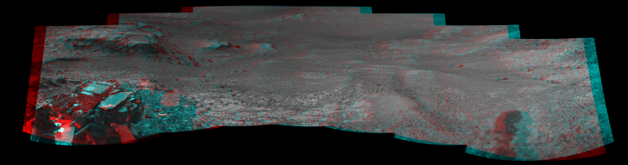 NASA's Mars rover Curiosity took 7 image pairs in Gale Crater using its mast-mounted Navigation Camera (Navcam) to create this mosaic. The seam-corrected mosaic provides a 241-degree cylindrical perspective projection panorama of the Martian surface suitable for stereo viewing, centered at 359 degrees azimuth (measured clockwise from north). This anaglyph must be viewed with red/blue glasses (red over left eye).  Curiosity took the images on July 10, 2015, Sol 1039 of the Mars Science Laboratory mission at drive 1970, site number 48. The local mean solar time for the image exposures was 4 PM. Each Navcam image has a 45-degree field of view. CREDIT: NASA/JPL-Caltech
