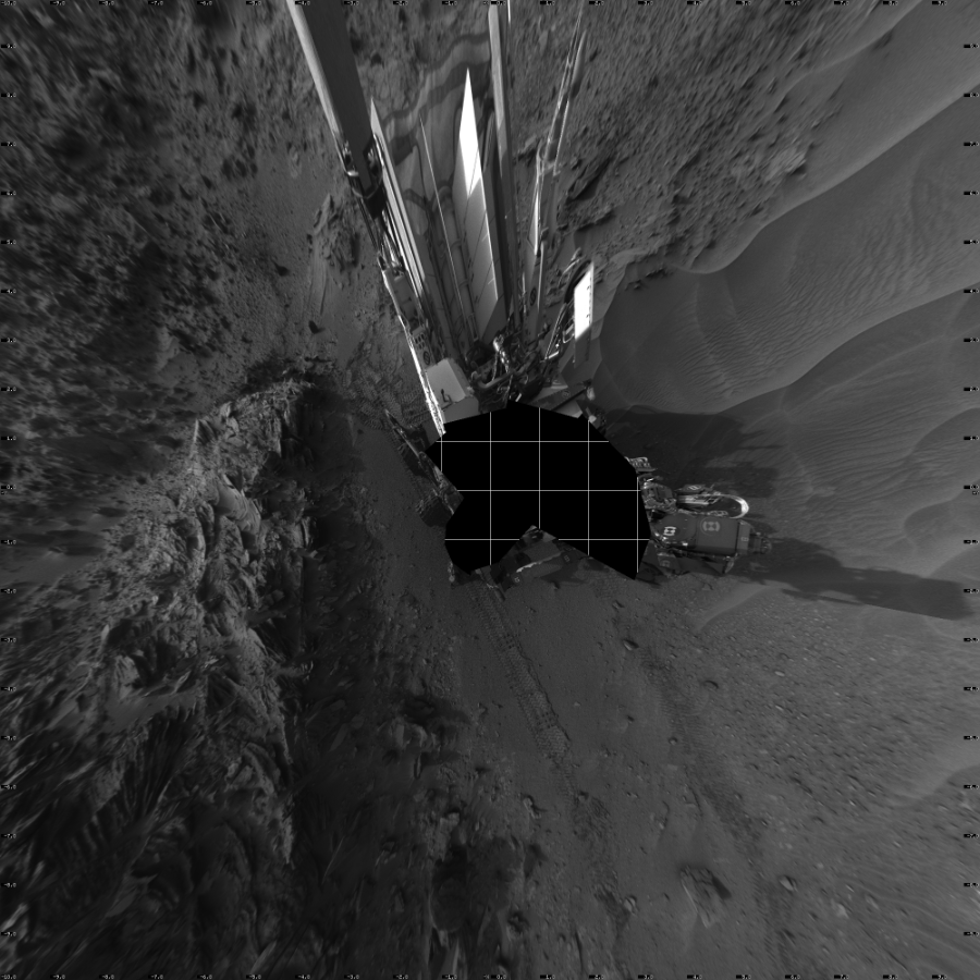 NASA's Mars rover Curiosity took 19 images in Gale Crater using its mast-mounted Left Navigation Camera (Navcam) to create this mosaic. The seam-corrected mosaic provides a vertical projection of the Martian surface near the rover, covering an area of 20 meters (north/south) by 20 meters (east/west). North is up in the image. This projection provides an overhead view, but introduces distortion for items not on the surface, such as large rocks and the rover itself.  Curiosity took the images on July 15, 2015, Sol 1044 of the Mars Science Laboratory mission at drive 2200, site number 48. The local mean solar time for the image exposures was 5 PM. Each Navcam image has a 45-degree field of view. CREDIT: NASA/JPL-Caltech