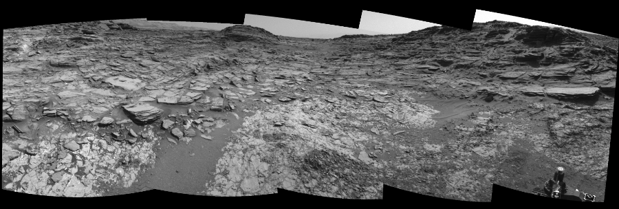 NASA's Mars rover Curiosity took 5 images in Gale Crater using its mast-mounted Left Navigation Camera (Navcam) to create this mosaic. The seam-corrected mosaic provides a 163-degree cylindrical-perspective projection panorama of the Martian surface suitable for stereo viewing, centered at 98 degrees azimuth (measured clockwise from north). This single-eye view must be combined with the partner right image to be viewed in stereo. Curiosity took the images on August 08, 2015, Sol 1067 of the Mars Science Laboratory mission at drive 0, site number 49. The local mean solar time for the image exposures was 2 PM. Each Navcam image has a 45-degree field of view. CREDIT: NASA/JPL-Caltech
