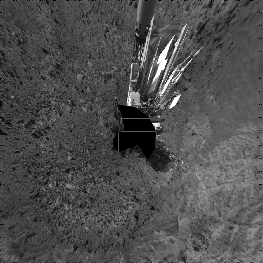 NASA's Mars rover Curiosity took 18 images in Gale Crater using its mast-mounted Left Navigation Camera (Navcam) to create this mosaic. The seam-corrected mosaic provides a vertical projection of the Martian surface near the rover, covering an area of 20 meters (north/south) by 20 meters (east/west). North is up in the image. This projection provides an overhead view, but introduces distortion for items not on the surface, such as large rocks and the rover itself.  Curiosity took the images on August 21, 2015, Sol 1080 of the Mars Science Laboratory mission at drive 1216, site number 49. The local mean solar time for the image exposures was from 3 PM to 4 PM. Each Navcam image has a 45-degree field of view. CREDIT: NASA/JPL-Caltech