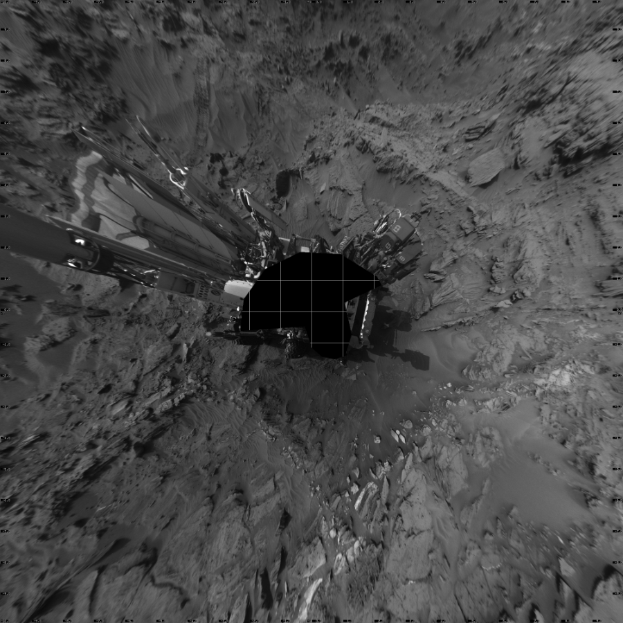 NASA's Mars rover Curiosity took 19 images in Gale Crater using its mast-mounted Left Navigation Camera (Navcam) to create this mosaic. The seam-corrected mosaic provides a vertical projection of the Martian surface near the rover, covering an area of 20 meters (north/south) by 20 meters (east/west). North is up in the image. This projection provides an overhead view, but introduces distortion for items not on the surface, such as large rocks and the rover itself.  Curiosity took the images on August 26, 2015, Sol 1085 of the Mars Science Laboratory mission at drive 1798, site number 49. The local mean solar time for the image exposures was 4 PM. Each Navcam image has a 45-degree field of view. CREDIT: NASA/JPL-Caltech