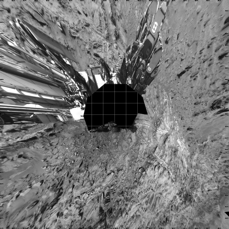 NASA's Mars rover Curiosity took 17 images in Gale Crater using its mast-mounted Left Navigation Camera (Navcam) to create this mosaic. The seam-corrected mosaic provides a vertical projection of the Martian surface near the rover, covering an area of 20 meters (north/south) by 20 meters (east/west). North is up in the image. This projection provides an overhead view, but introduces distortion for items not on the surface, such as large rocks and the rover itself. Curiosity took the images on September 03, 2015, Sol 1093 of the Mars Science Laboratory mission at drive 2026, site number 49. The local mean solar time for the image exposures was 2 PM. Each Navcam image has a 45-degree field of view. CREDIT: NASA/JPL-Caltech