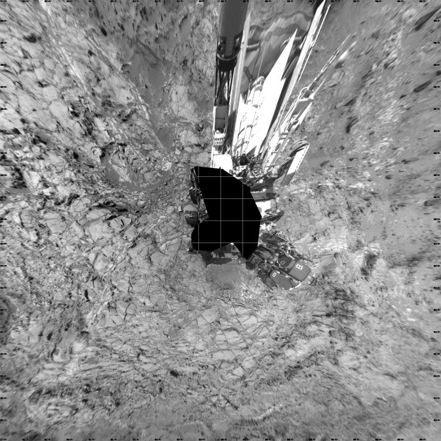 NASA's Mars rover Curiosity took 21 images in Gale Crater using its mast-mounted Left Navigation Camera (Navcam) to create this mosaic. The seam-corrected mosaic provides a vertical projection of the Martian surface near the rover, covering an area of 20 meters (north/south) by 20 meters (east/west). North is up in the image. This projection provides an overhead view, but introduces distortion for items not on the surface, such as large rocks and the rover itself.  Curiosity took the images on September 04, 2015, Sol 1094 of the Mars Science Laboratory mission at drive 2236, site number 49. The local mean solar time for the image exposures was from 1 PM to 2 PM. Each Navcam image has a 45-degree field of view. CREDIT: NASA/JPL-Caltech