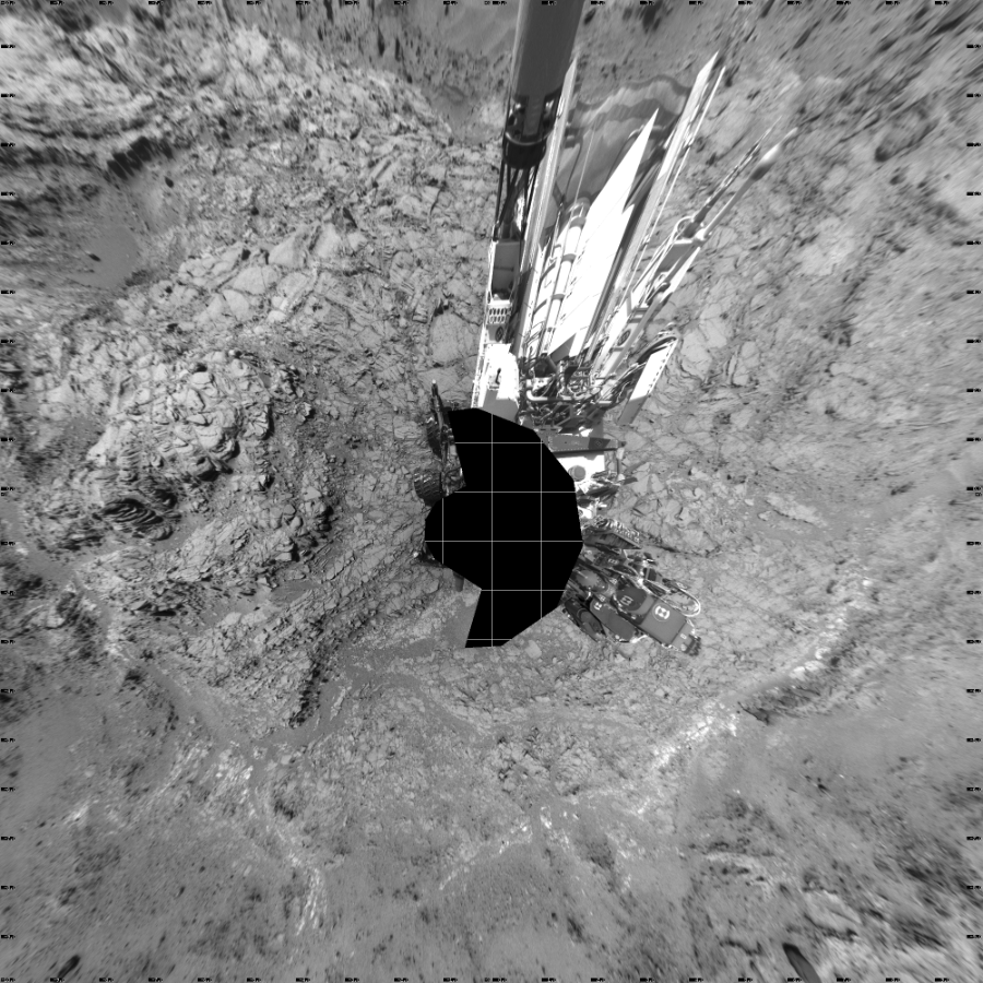 NASA's Mars rover Curiosity took 17 images in Gale Crater using its mast-mounted Left Navigation Camera (Navcam) to create this mosaic. The seam-corrected mosaic provides a vertical projection of the Martian surface near the rover, covering an area of 20 meters (north/south) by 20 meters (east/west). North is up in the image. This projection provides an overhead view, but introduces distortion for items not on the surface, such as large rocks and the rover itself.  Curiosity took the images on September 08, 2015, Sol 1098 of the Mars Science Laboratory mission at drive 2374, site number 49. The local mean solar time for the image exposures was 2 PM. Each Navcam image has a 45-degree field of view. CREDIT: NASA/JPL-Caltech