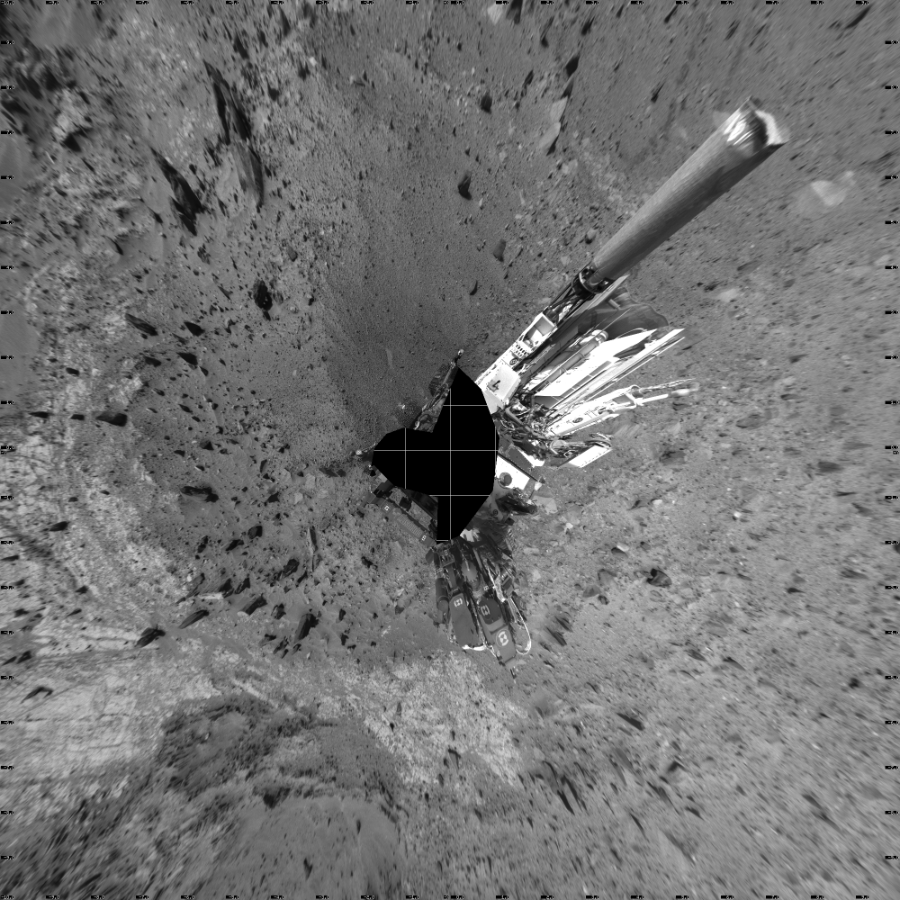 NASA's Mars rover Curiosity took 19 images in Gale Crater using its mast-mounted Left Navigation Camera (Navcam) to create this mosaic. The seam-corrected mosaic provides a vertical projection of the Martian surface near the rover, covering an area of 20 meters (north/south) by 20 meters (east/west). North is up in the image. This projection provides an overhead view, but introduces distortion for items not on the surface, such as large rocks and the rover itself.  Curiosity took the images on September 10, 2015, Sol 1100 of the Mars Science Laboratory mission at drive 2902, site number 49. The local mean solar time for the image exposures was from 2 PM to 3 PM. Each Navcam image has a 45-degree field of view. CREDIT: NASA/JPL-Caltech