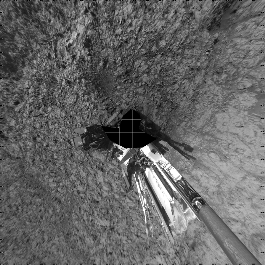 NASA's Mars rover Curiosity took 19 images in Gale Crater using its mast-mounted Left Navigation Camera (Navcam) to create this mosaic. The seam-corrected mosaic provides a vertical projection of the Martian surface near the rover, covering an area of 20 meters (north/south) by 20 meters (east/west). North is up in the image. This projection provides an overhead view, but introduces distortion for items not on the surface, such as large rocks and the rover itself. Curiosity took the images on November 13, 2015, Sol 1162 of the Mars Science Laboratory mission at drive 3076, site number 50. The local mean solar time for the image exposures was from 3 PM to 4 PM. Each Navcam image has a 45-degree field of view. CREDIT: NASA/JPL-Caltech