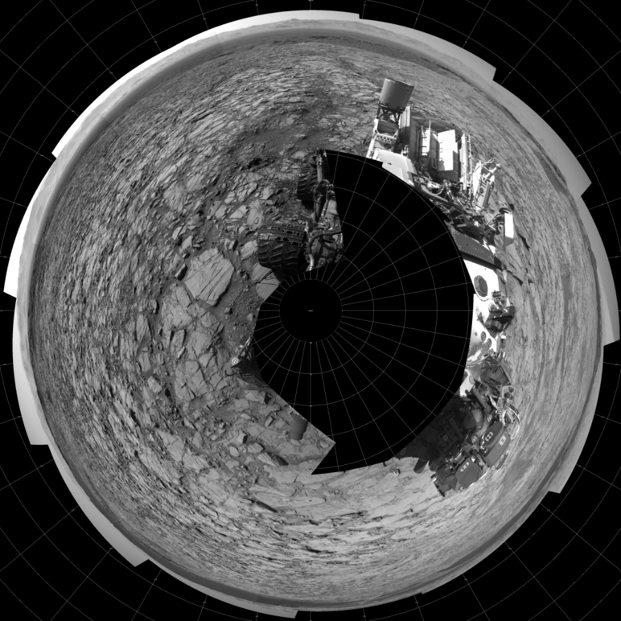 NASA's Mars rover Curiosity took 17 images in Gale Crater using its mast-mounted Left Navigation Camera (Navcam) to create this mosaic. The seam-corrected mosaic provides a polar stereographic projection panorama of the Martian surface with 0 degrees azimuth (measured clockwise from north) at the top of the image. Curiosity took the images on November 18, 2015, Sol 1167 of the Mars Science Laboratory mission at drive 0, site number 51. The local mean solar time for the image exposures was from 2 PM to 3 PM. Each Navcam image has a 45-degree field of view. CREDIT: NASA/JPL-Caltech