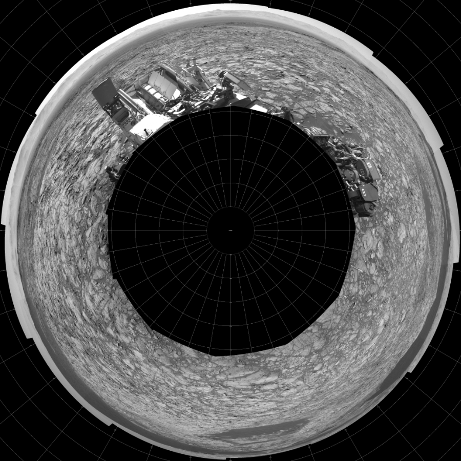 NASA's Mars rover Curiosity took 12 images in Gale Crater using its mast-mounted Left Navigation Camera (Navcam) to create this mosaic. The seam-corrected mosaic provides a polar stereographic projection panorama of the Martian surface with 0 degrees azimuth (measured clockwise from north) at the top of the image. Curiosity took the images on November 23, 2015, Sol 1172 of the Mars Science Laboratory mission at drive 592, site number 51. The local mean solar time for the image exposures was 1 PM. Each Navcam image has a 45-degree field of view. CREDIT: NASA/JPL-Caltech