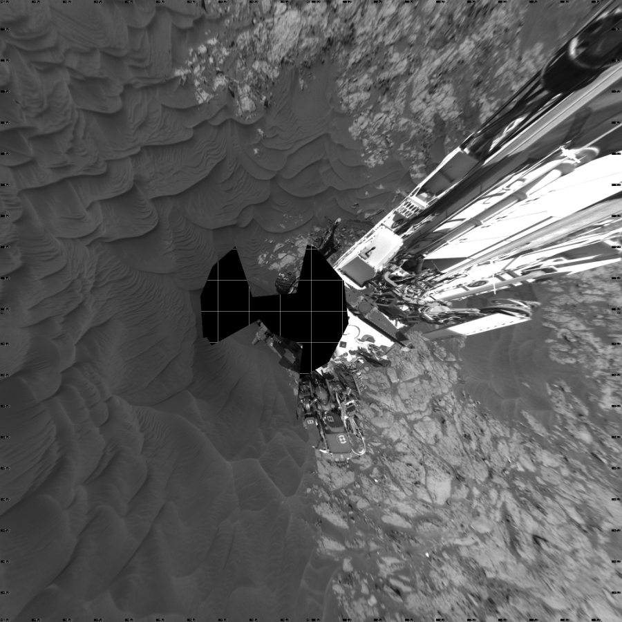 NASA's Mars rover Curiosity took 15 images in Gale Crater using its mast-mounted Left Navigation Camera (Navcam) to create this mosaic. The seam-corrected mosaic provides a vertical projection of the Martian surface near the rover, covering an area of 20 meters (north/south) by 20 meters (east/west). North is up in the image. This projection provides an overhead view, but introduces distortion for items not on the surface, such as large rocks and the rover itself.  Curiosity took the images on December 05, 2015, Sol 1183 of the Mars Science Laboratory mission at drive 1430, site number 51. The local mean solar time for the image exposures was 2 PM. Each Navcam image has a 45-degree field of view. CREDIT: NASA/JPL-Caltech