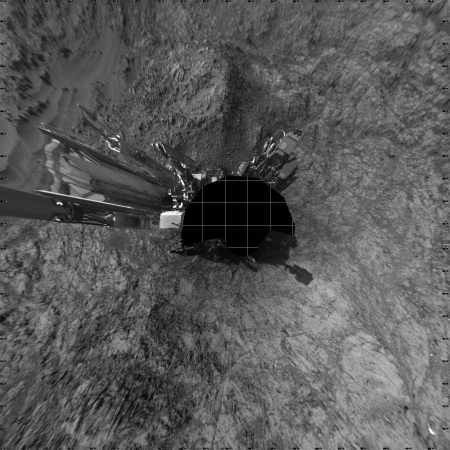 NASA's Mars rover Curiosity took 17 images in Gale Crater using its mast-mounted Left Navigation Camera (Navcam) to create this mosaic. The seam-corrected mosaic provides a vertical projection of the Martian surface near the rover, covering an area of 20 meters (north/south) by 20 meters (east/west). North is up in the image. This projection provides an overhead view, but introduces distortion for items not on the surface, such as large rocks and the rover itself.  Curiosity took the images on December 09, 2015, Sol 1187 of the Mars Science Laboratory mission at drive 2004, site number 51. The local mean solar time for the image exposures was from 3 PM to 4 PM. Each Navcam image has a 45-degree field of view. CREDIT: NASA/JPL-Caltech