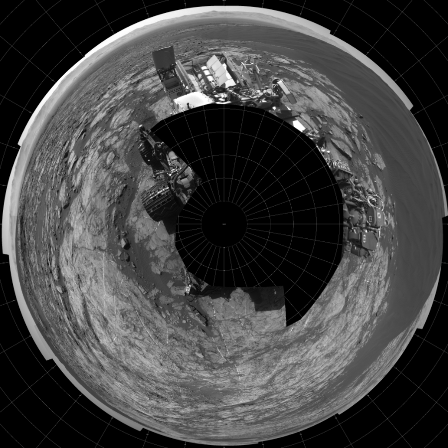 NASA's Mars rover Curiosity took 17 images in Gale Crater using its mast-mounted Left Navigation Camera (Navcam) to create this mosaic. The seam-corrected mosaic provides a polar stereographic projection panorama of the Martian surface with 0 degrees azimuth (measured clockwise from north) at the top of the image. Curiosity took the images on December 14, 2015, Sol 1192 of the Mars Science Laboratory mission at drive 2322, site number 51. The local mean solar time for the image exposures was 1 PM. Each Navcam image has a 45-degree field of view. CREDIT: NASA/JPL-Caltech