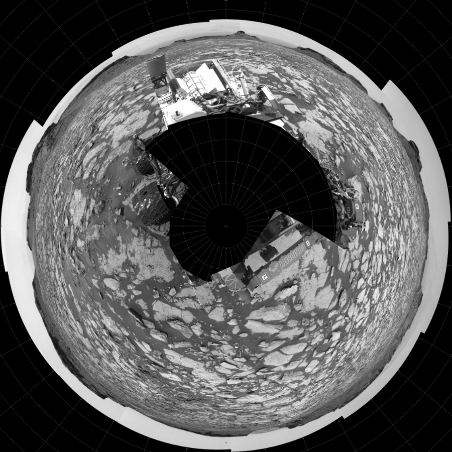 NASA's Mars rover Curiosity took 27 images in Gale Crater using its mast-mounted Left Navigation Camera (Navcam) to create this mosaic. The seam-corrected mosaic provides a polar stereographic projection panorama of the Martian surface with 0 degrees azimuth (measured clockwise from north) at the top of the image. Curiosity took the images on August 23, 2016, Sol 1438 of the Mars Science Laboratory mission at drive 774, site number 57. The local mean solar time for the image exposures was 12 PM. Each Navcam image has a 45-degree field of view. CREDIT: NASA/JPL-Caltech