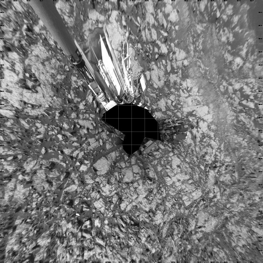 NASA's Mars rover Curiosity took 19 images in Gale Crater using its mast-mounted Left Navigation Camera (Navcam) to create this mosaic. The seam-corrected mosaic provides a vertical projection of the Martian surface near the rover, covering an area of 20 meters (north/south) by 20 meters (east/west). North is up in the image. This projection provides an overhead view, but introduces distortion for items not on the surface, such as large rocks and the rover itself.  Curiosity took the images on September 24, 2016, Sol 1469 of the Mars Science Laboratory mission at drive 264, site number 58. The local mean solar time for the image exposures was 2 PM. Each Navcam image has a 45-degree field of view. CREDIT: NASA/JPL-Caltech