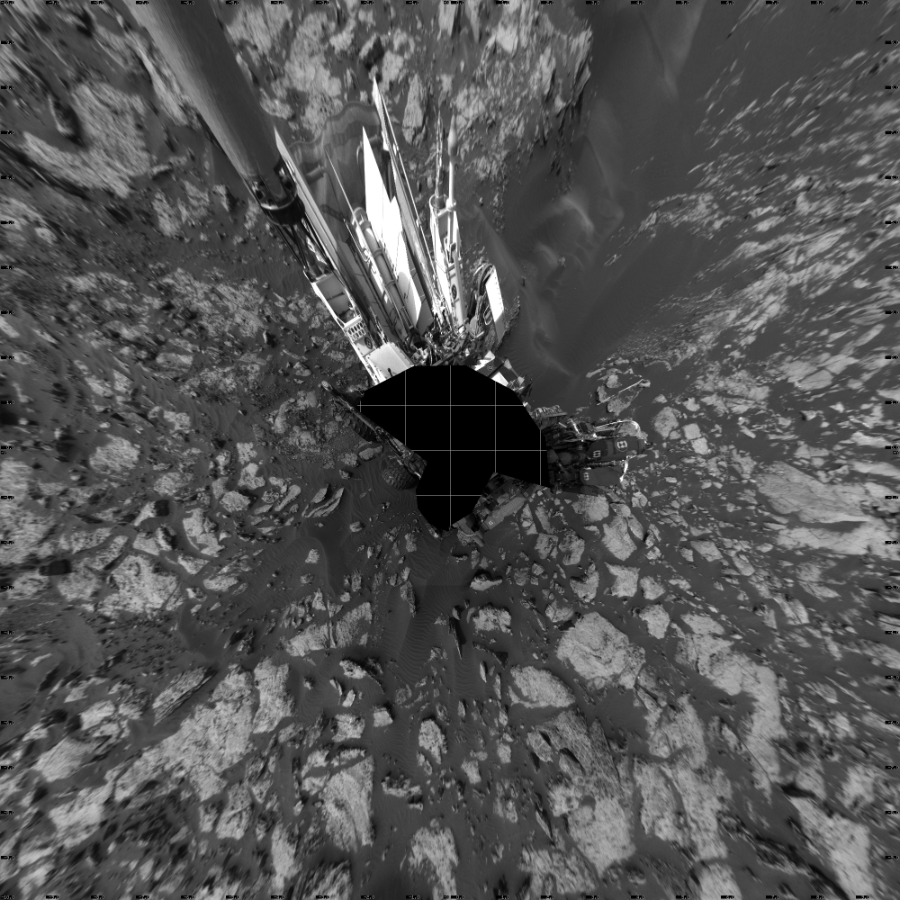 NASA's Mars rover Curiosity took 19 images in Gale Crater using its mast-mounted Left Navigation Camera (Navcam) to create this mosaic. The seam-corrected mosaic provides a vertical projection of the Martian surface near the rover, covering an area of 20 meters (north/south) by 20 meters (east/west). North is up in the image. This projection provides an overhead view, but introduces distortion for items not on the surface, such as large rocks and the rover itself.  Curiosity took the images on September 26, 2016, Sol 1471 of the Mars Science Laboratory mission at drive 642, site number 58. The local mean solar time for the image exposures was 2 PM. Each Navcam image has a 45-degree field of view. CREDIT: NASA/JPL-Caltech