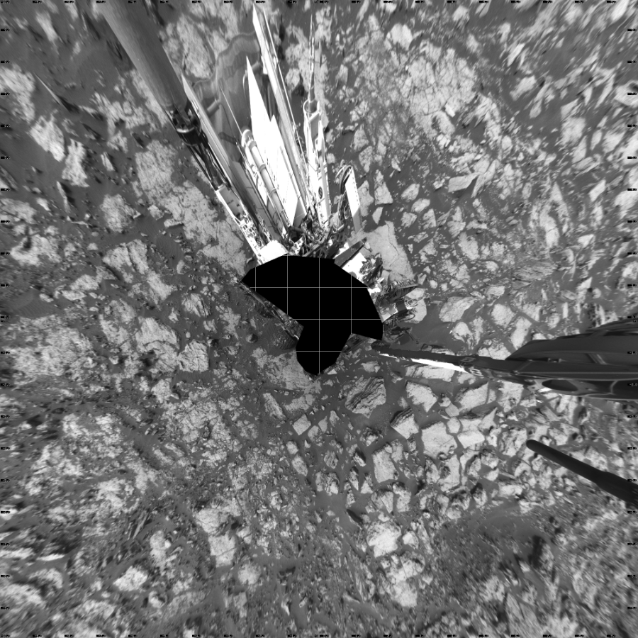 NASA's Mars rover Curiosity took 19 images in Gale Crater using its mast-mounted Left Navigation Camera (Navcam) to create this mosaic. The seam-corrected mosaic provides a vertical projection of the Martian surface near the rover, covering an area of 20 meters (north/south) by 20 meters (east/west). North is up in the image. This projection provides an overhead view, but introduces distortion for items not on the surface, such as large rocks and the rover itself.  Curiosity took the images on September 28, 2016, Sol 1473 of the Mars Science Laboratory mission at drive 774, site number 58. The local mean solar time for the image exposures was 2 PM. Each Navcam image has a 45-degree field of view. CREDIT: NASA/JPL-Caltech