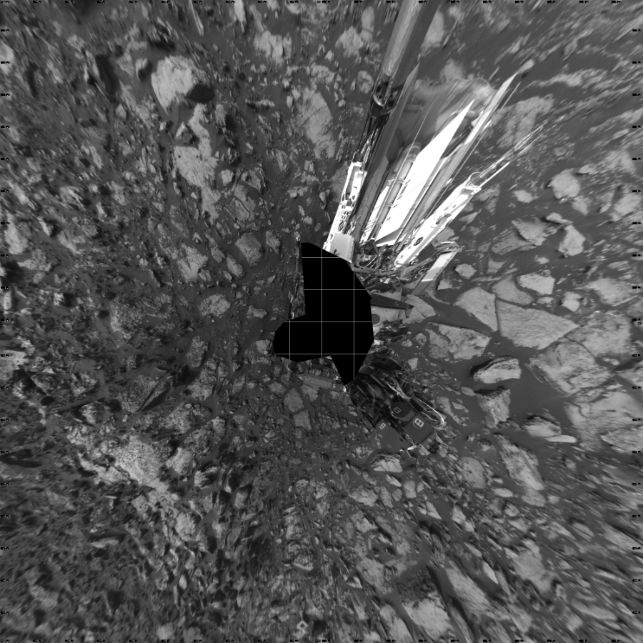 NASA's Mars rover Curiosity took 19 images in Gale Crater using its mast-mounted Left Navigation Camera (Navcam) to create this mosaic. The seam-corrected mosaic provides a vertical projection of the Martian surface near the rover, covering an area of 20 meters (north/south) by 20 meters (east/west). North is up in the image. This projection provides an overhead view, but introduces distortion for items not on the surface, such as large rocks and the rover itself.  Curiosity took the images on September 30, 2016, Sol 1475 of the Mars Science Laboratory mission at drive 912, site number 58. The local mean solar time for the image exposures was 3 PM. Each Navcam image has a 45-degree field of view. CREDIT: NASA/JPL-Caltech