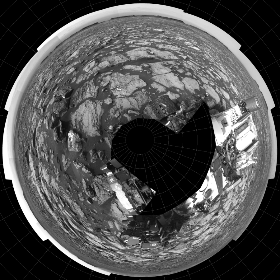 NASA's Mars rover Curiosity took 18 images in Gale Crater using its mast-mounted Left Navigation Camera (Navcam) to create this mosaic. The seam-corrected mosaic provides a polar stereographic projection panorama of the Martian surface with 0 degrees azimuth (measured clockwise from north) at the top of the image. Curiosity took the images on October 12, 2016, Sol 1487 of the Mars Science Laboratory mission at drive 1986, site number 58. The local mean solar time for the image exposures was 3 PM. Each Navcam image has a 45-degree field of view. CREDIT: NASA/JPL-Caltech