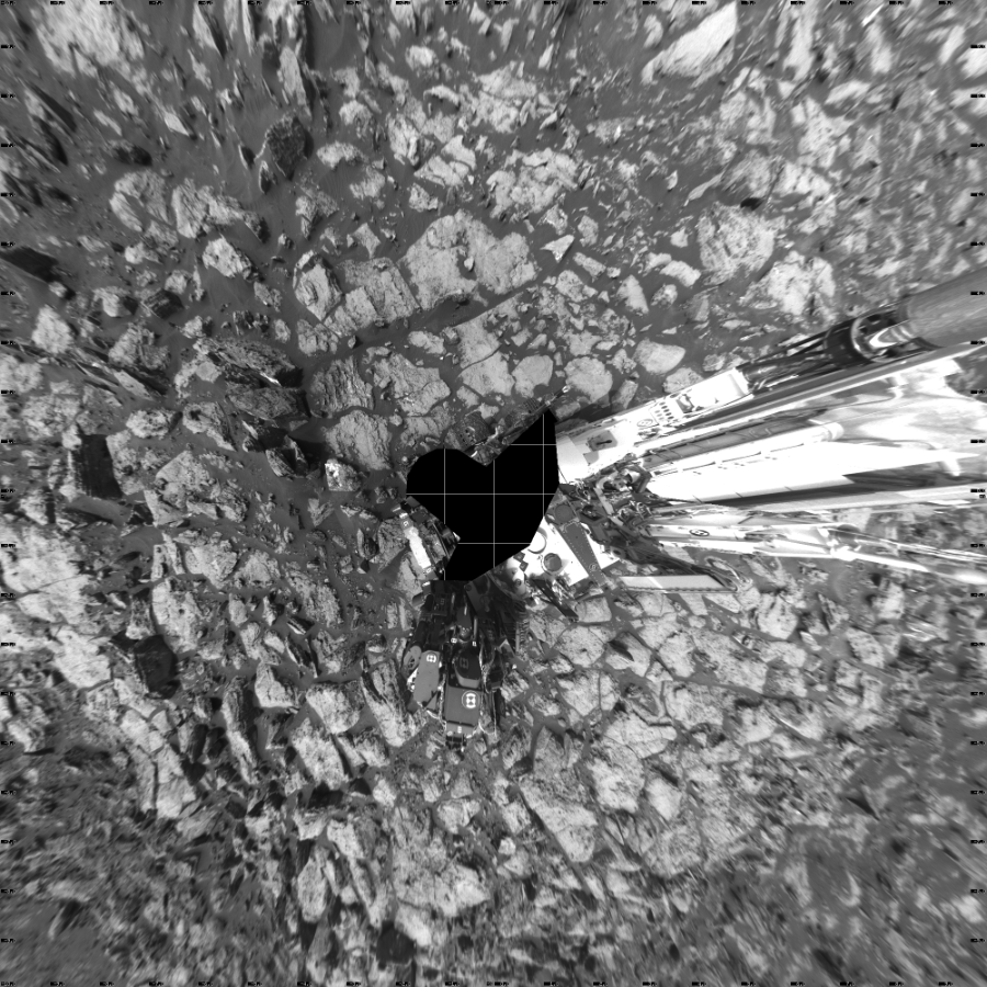 NASA's Mars rover Curiosity took 18 images in Gale Crater using its mast-mounted Left Navigation Camera (Navcam) to create this mosaic. The seam-corrected mosaic provides a vertical projection of the Martian surface near the rover, covering an area of 20 meters (north/south) by 20 meters (east/west). North is up in the image. This projection provides an overhead view, but introduces distortion for items not on the surface, such as large rocks and the rover itself.  Curiosity took the images on October 12, 2016, Sol 1487 of the Mars Science Laboratory mission at drive 1986, site number 58. The local mean solar time for the image exposures was 3 PM. Each Navcam image has a 45-degree field of view. CREDIT: NASA/JPL-Caltech