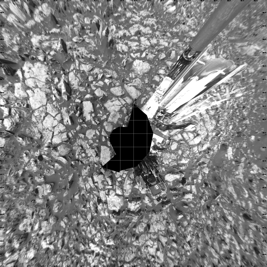 NASA's Mars rover Curiosity took 17 images in Gale Crater using its mast-mounted Left Navigation Camera (Navcam) to create this mosaic. The seam-corrected mosaic provides a vertical projection of the Martian surface near the rover, covering an area of 20 meters (north/south) by 20 meters (east/west). North is up in the image. This projection provides an overhead view, but introduces distortion for items not on the surface, such as large rocks and the rover itself.  Curiosity took the images on October 24, 2016, Sol 1499 of the Mars Science Laboratory mission at drive 2136, site number 58. The local mean solar time for the image exposures was 1 PM. Each Navcam image has a 45-degree field of view. CREDIT: NASA/JPL-Caltech