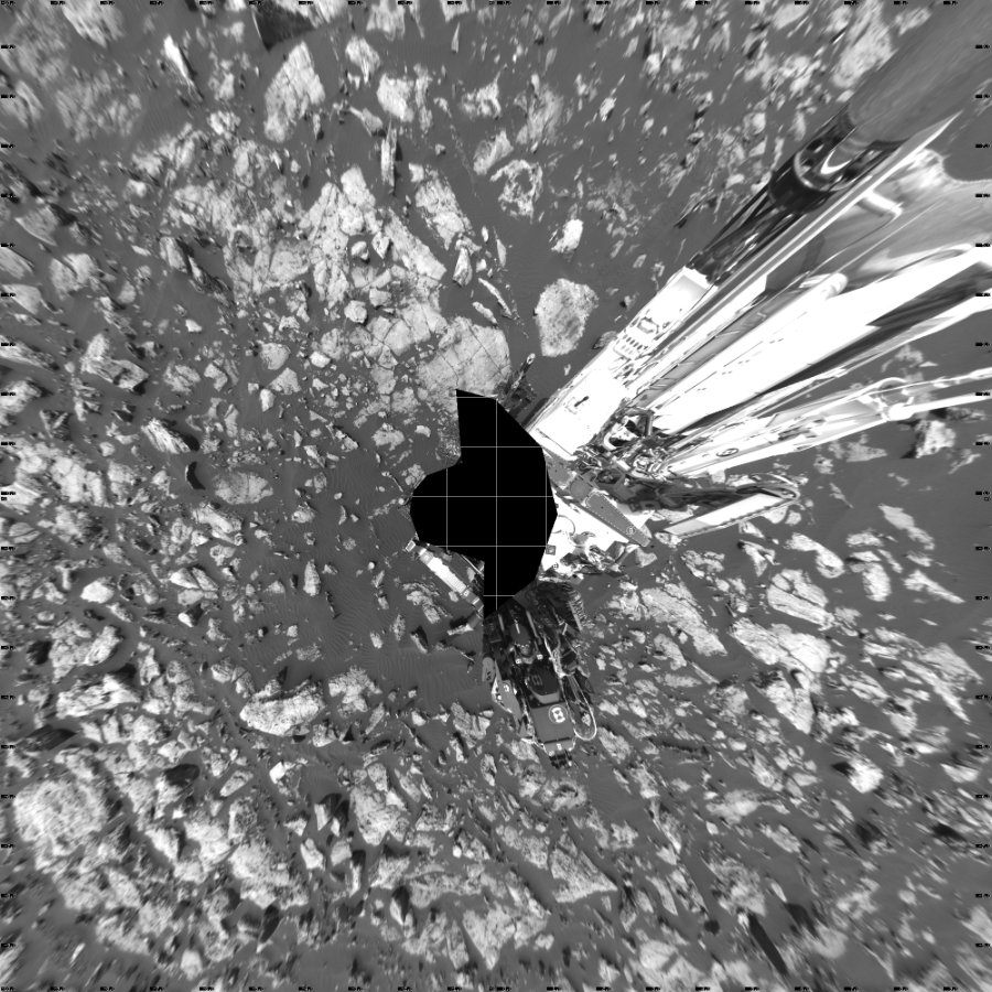 NASA's Mars rover Curiosity took 17 images in Gale Crater using its mast-mounted Left Navigation Camera (Navcam) to create this mosaic. The seam-corrected mosaic provides a vertical projection of the Martian surface near the rover, covering an area of 20 meters (north/south) by 20 meters (east/west). North is up in the image. This projection provides an overhead view, but introduces distortion for items not on the surface, such as large rocks and the rover itself.  Curiosity took the images on November 02, 2016, Sol 1507 of the Mars Science Laboratory mission at drive 612, site number 59. The local mean solar time for the image exposures was 2 PM. Each Navcam image has a 45-degree field of view. CREDIT: NASA/JPL-Caltech