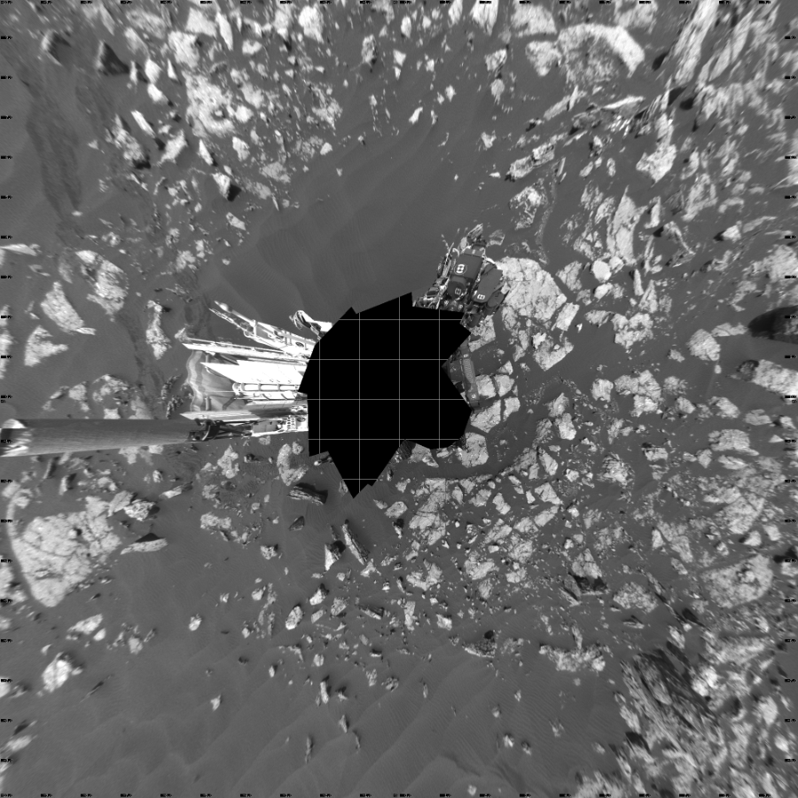 NASA's Mars rover Curiosity took 17 images in Gale Crater using its mast-mounted Left Navigation Camera (Navcam) to create this mosaic. The seam-corrected mosaic provides a vertical projection of the Martian surface near the rover, covering an area of 20 meters (north/south) by 20 meters (east/west). North is up in the image. This projection provides an overhead view, but introduces distortion for items not on the surface, such as large rocks and the rover itself.  Curiosity took the images on November 14, 2016, Sol 1519 of the Mars Science Laboratory mission at drive 2578, site number 59. The local mean solar time for the image exposures was 1 PM. Each Navcam image has a 45-degree field of view. CREDIT: NASA/JPL-Caltech