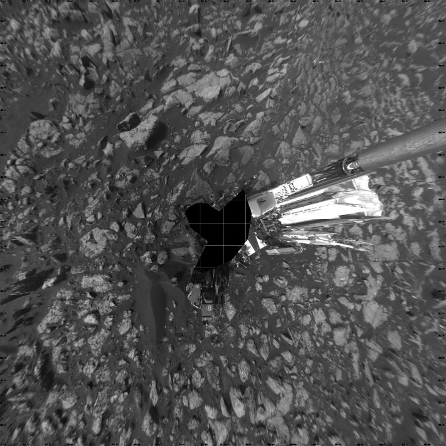 NASA's Mars rover Curiosity took 23 images in Gale Crater using its mast-mounted Left Navigation Camera (Navcam) to create this mosaic. The seam-corrected mosaic provides a vertical projection of the Martian surface near the rover, covering an area of 20 meters (north/south) by 20 meters (east/west). North is up in the image. This projection provides an overhead view, but introduces distortion for items not on the surface, such as large rocks and the rover itself.  Curiosity took the images on December 21, 2016, Sols 1555-1559 of the Mars Science Laboratory mission at drive 3016, site number 59. The local mean solar time for the image exposures was from 4 PM to 12 PM. Each Navcam image has a 45-degree field of view. CREDIT: NASA/JPL-Caltech