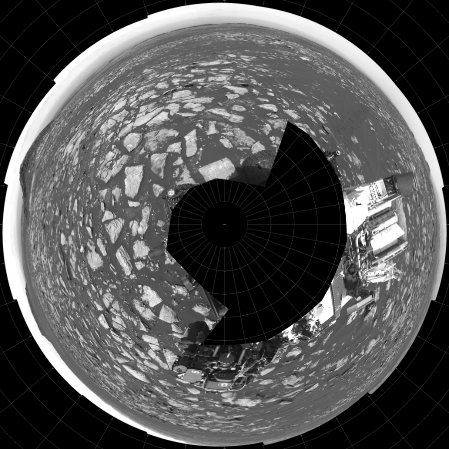 NASA's Mars rover Curiosity took 17 images in Gale Crater using its mast-mounted Left Navigation Camera (Navcam) to create this mosaic. The seam-corrected mosaic provides a polar stereographic projection panorama of the Martian surface with 0 degrees azimuth (measured clockwise from north) at the top of the image. Curiosity took the images on January 30, 2017, Sol 1594 of the Mars Science Laboratory mission at drive 2574, site number 60. The local mean solar time for the image exposures was from 1 PM to 3 PM. Each Navcam image has a 45-degree field of view. CREDIT: NASA/JPL-Caltech