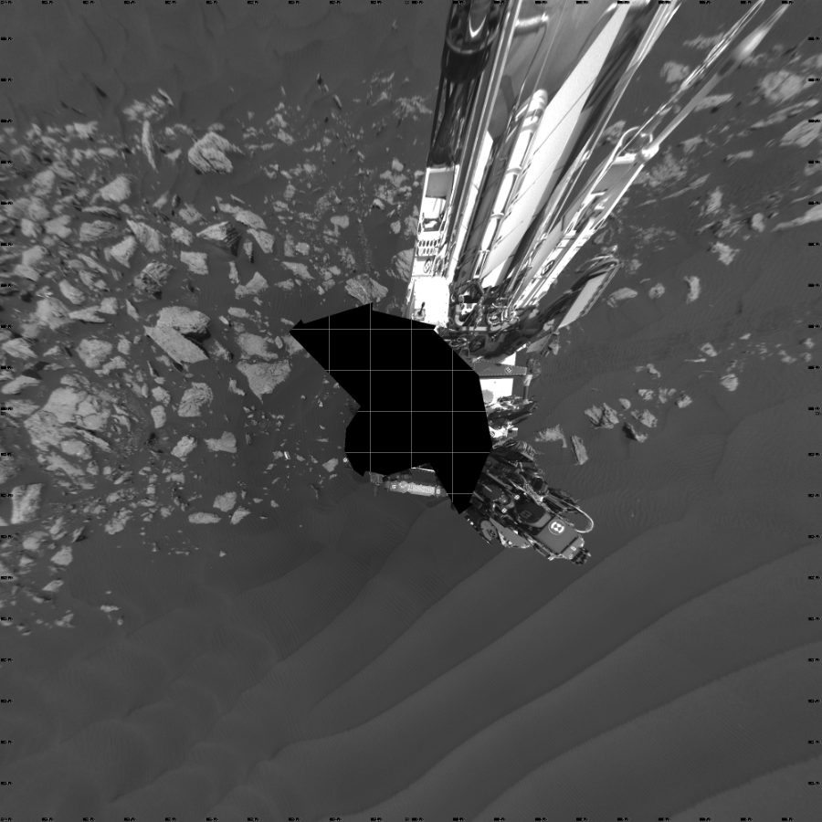 NASA's Mars rover Curiosity took 18 images in Gale Crater using its mast-mounted Left Navigation Camera (Navcam) to create this mosaic. The seam-corrected mosaic provides a vertical projection of the Martian surface near the rover, covering an area of 20 meters (north/south) by 20 meters (east/west). North is up in the image. This projection provides an overhead view, but introduces distortion for items not on the surface, such as large rocks and the rover itself.  Curiosity took the images on February 06, 2017, Sol 1601 of the Mars Science Laboratory mission at drive 3162, site number 60. The local mean solar time for the image exposures was 1 PM. Each Navcam image has a 45-degree field of view. CREDIT: NASA/JPL-Caltech