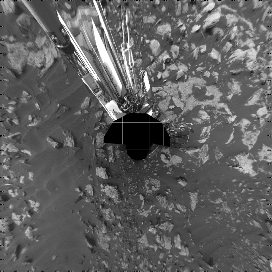 NASA's Mars rover Curiosity took 17 images in Gale Crater using its mast-mounted Left Navigation Camera (Navcam) to create this mosaic. The seam-corrected mosaic provides a vertical projection of the Martian surface near the rover, covering an area of 20 meters (north/south) by 20 meters (east/west). North is up in the image. This projection provides an overhead view, but introduces distortion for items not on the surface, such as large rocks and the rover itself.  Curiosity took the images on March 08, 2017, Sol 1630 of the Mars Science Laboratory mission at drive 1650, site number 61. The local mean solar time for the image exposures was 5 PM. Each Navcam image has a 45-degree field of view. CREDIT: NASA/JPL-Caltech