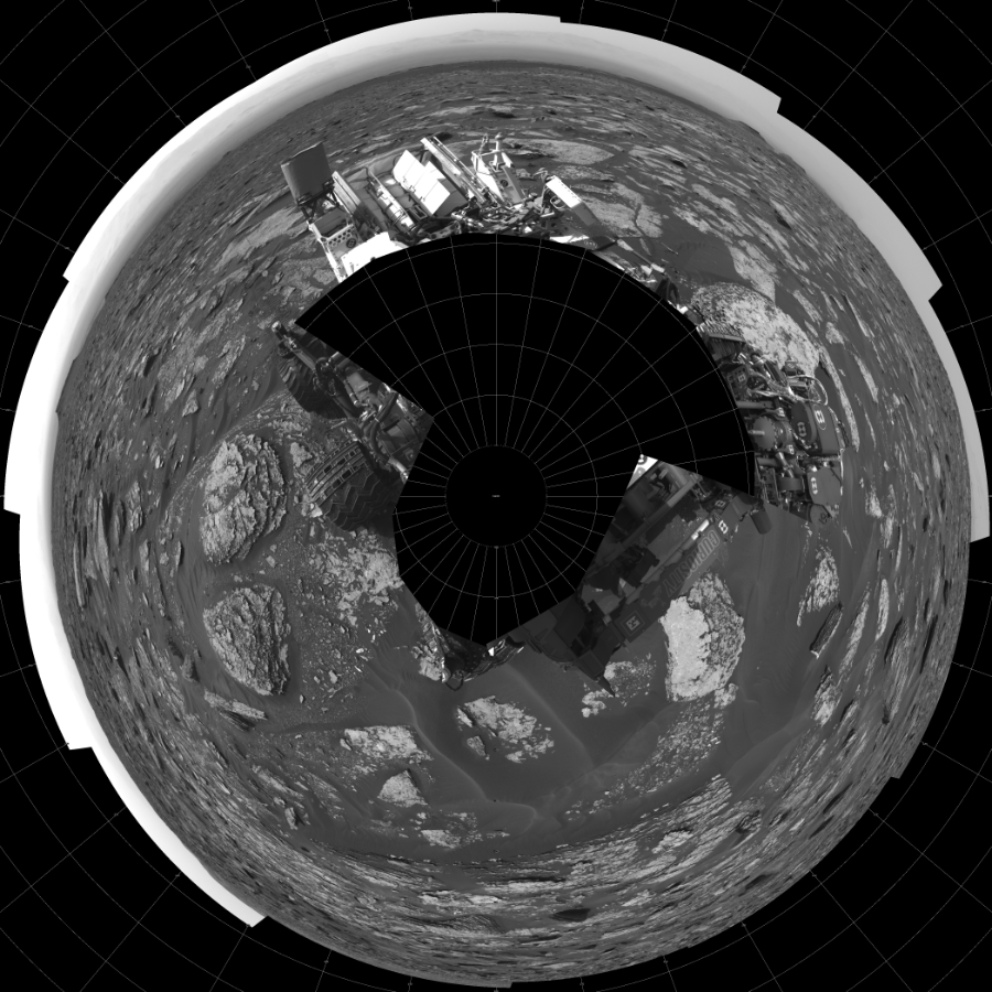 NASA's Mars rover Curiosity took 19 images in Gale Crater using its mast-mounted Left Navigation Camera (Navcam) to create this mosaic. The seam-corrected mosaic provides a polar stereographic projection panorama of the Martian surface with 0 degrees azimuth (measured clockwise from north) at the top of the image. Curiosity took the images on May 19, 2017, Sol 1700 of the Mars Science Laboratory mission at drive 1420, site number 63. The local mean solar time for the image exposures was from 2 PM to 4 PM. Each Navcam image has a 45-degree field of view. CREDIT: NASA/JPL-Caltech