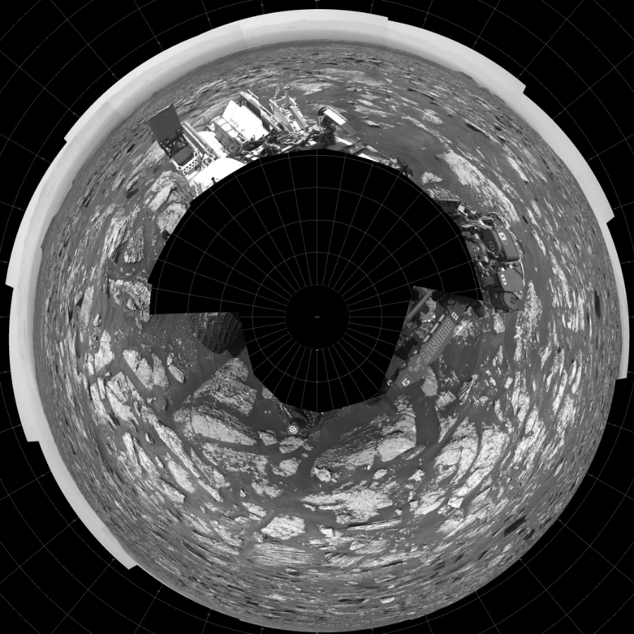 NASA's Mars rover Curiosity took 17 images in Gale Crater using its mast-mounted Left Navigation Camera (Navcam) to create this mosaic. The seam-corrected mosaic provides a polar stereographic projection panorama of the Martian surface with 0 degrees azimuth (measured clockwise from north) at the top of the image. Curiosity took the images on June 05, 2017, Sol 1717 of the Mars Science Laboratory mission at drive 2372, site number 63. The local mean solar time for the image exposures was 1 PM. Each Navcam image has a 45-degree field of view. CREDIT: NASA/JPL-Caltech