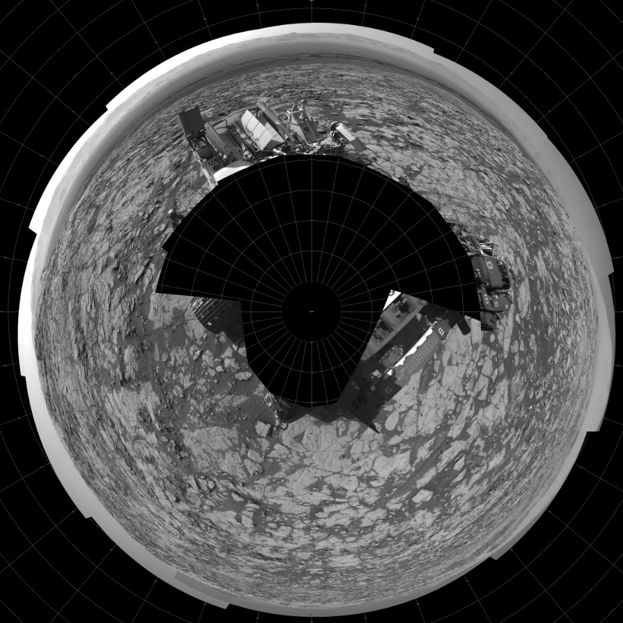 NASA's Mars rover Curiosity took 17 images in Gale Crater using its mast-mounted Left Navigation Camera (Navcam) to create this mosaic. The seam-corrected mosaic provides a polar stereographic projection panorama of the Martian surface with 0 degrees azimuth (measured clockwise from north) at the top of the image. Curiosity took the images on September 26, 2017, Sol 1827 of the Mars Science Laboratory mission at drive 450, site number 66. The local mean solar time for the image exposures was 3 PM. Each Navcam image has a 45-degree field of view. CREDIT: NASA/JPL-Caltech