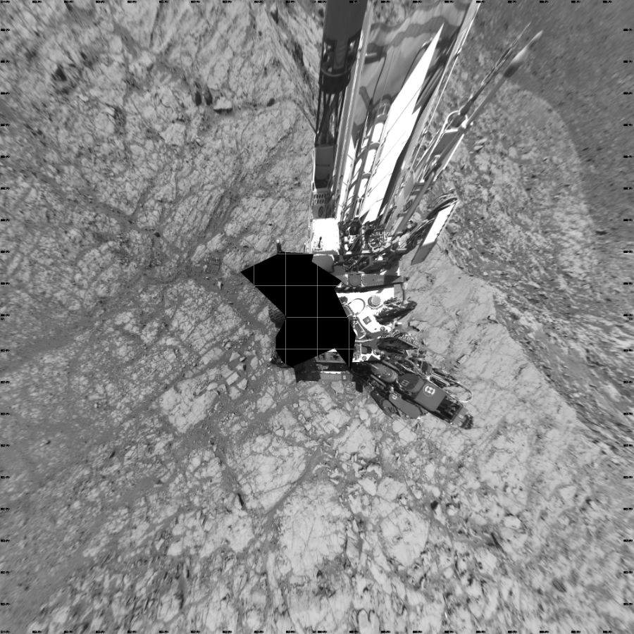 NASA's Mars rover Curiosity took 17 images in Gale Crater using its mast-mounted Left Navigation Camera (Navcam) to create this mosaic. The seam-corrected mosaic provides a vertical projection of the Martian surface near the rover, covering an area of 20 meters (north/south) by 20 meters (east/west). North is up in the image. This projection provides an overhead view, but introduces distortion for items not on the surface, such as large rocks and the rover itself. Curiosity took the images on October 07, 2017, Sol 1837 of the Mars Science Laboratory mission at drive 1332, site number 66. The local mean solar time for the image exposures was 1 PM. Each Navcam image has a 45-degree field of view. CREDIT: NASA/JPL-Caltech